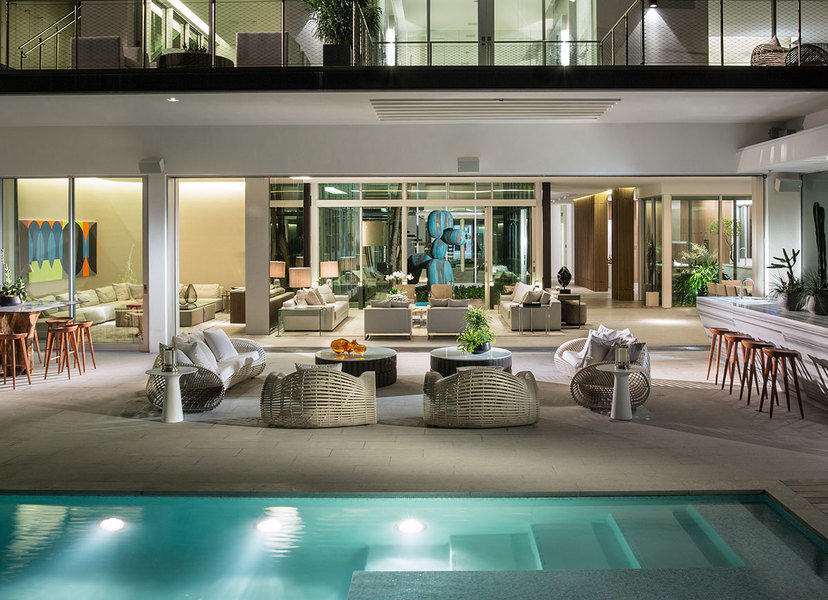 Woven furniture designed by Artefacto brings a natural, raw quality to a Miami patio.