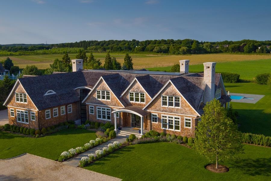 Sitting on almost three private acres, the resort-style home in Water Mill offers 10 spacious bedroom