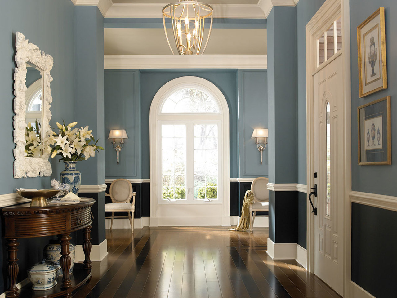 A tone-toned foyer is anchored by a darker hue closer to the floor.