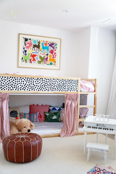 A combined playroom/ bedroom designed by Quinn Cooper comes to life thanks to modern artwork, a color