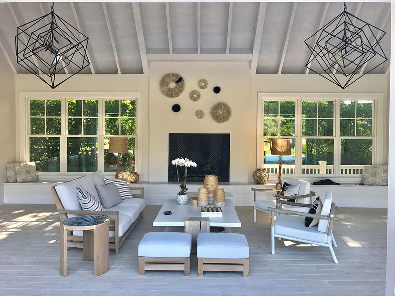 Practical porcelain tile, designed to mimic bleached oak flooring, gives this pool house designed by