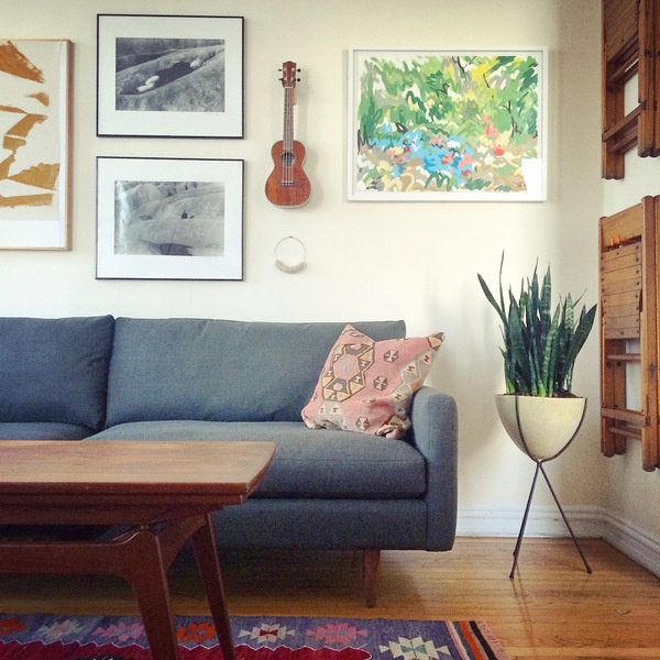 Here, Dara Segal of Simply Framed designed a mixed-media gallery wall, which lends personality and a