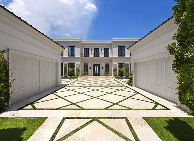 This landscaping designed by Fernando Wong, focuses on geometrical pavers and shrubbery, which create
